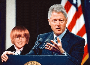 President Clinton welcomes adorable Cousin Oliver to the White House family.